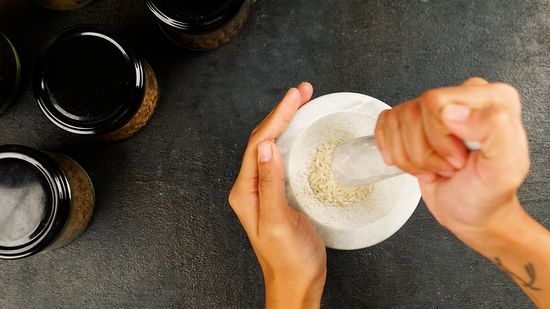 pounding spices in a mortar